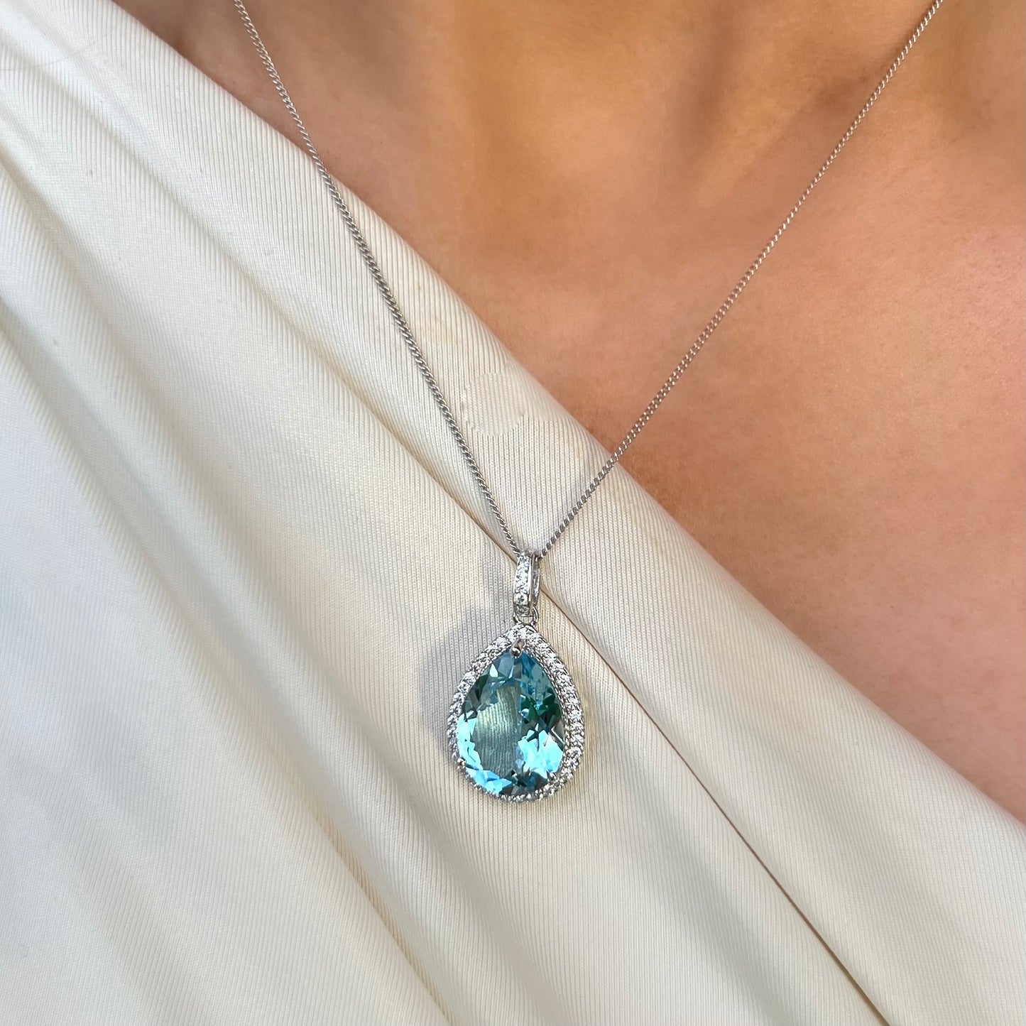 Sterling Silver Pear Cut Blue Topaz & Cubic Zircoa Necklace