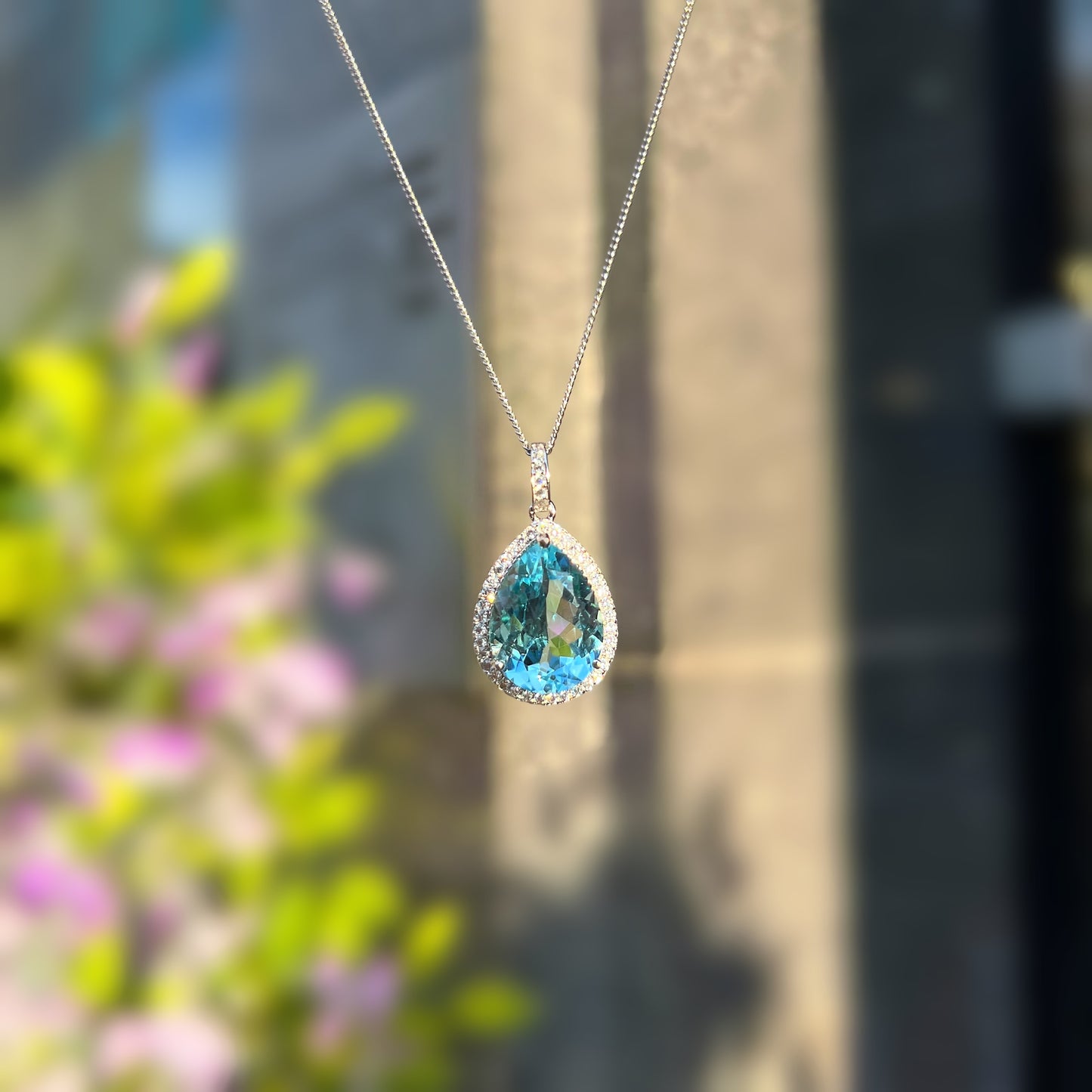 Sterling Silver Pear Cut Blue Topaz & Cubic Zircoa Necklace