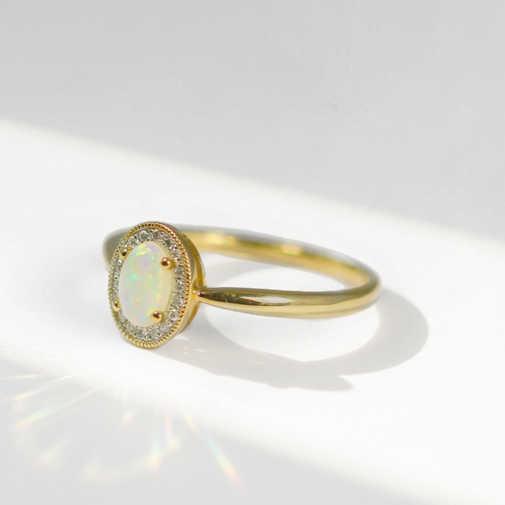 Oval Opal and Diamond 9ct Yellow Gold Halo Ring | Size O
