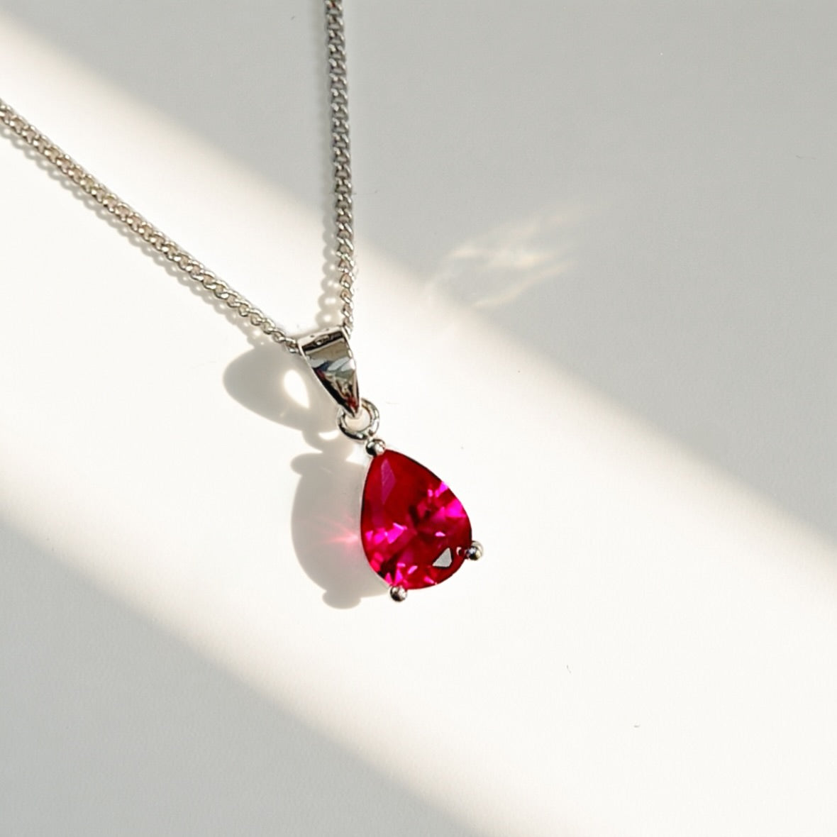 Sterling Silver Pear-Cut Lab-Grown Ruby Matching Necklace and Earring Set