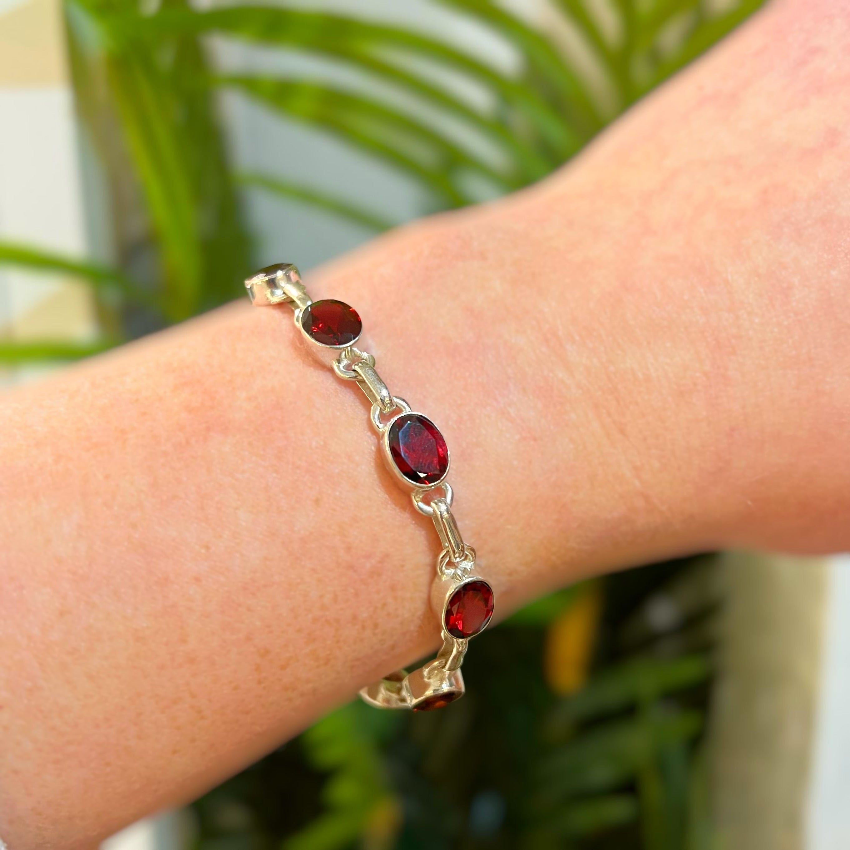 Oval Faceted Bezel Set Garnet Sterling Silver Bracelet