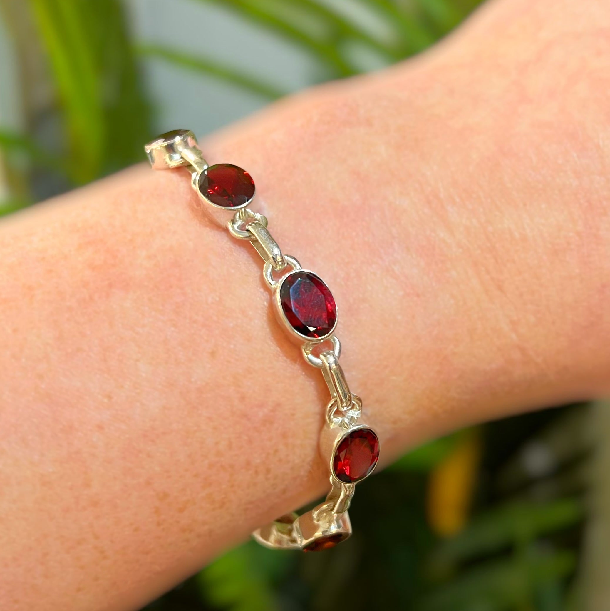 Oval Faceted Bezel Set Garnet Sterling Silver Bracelet