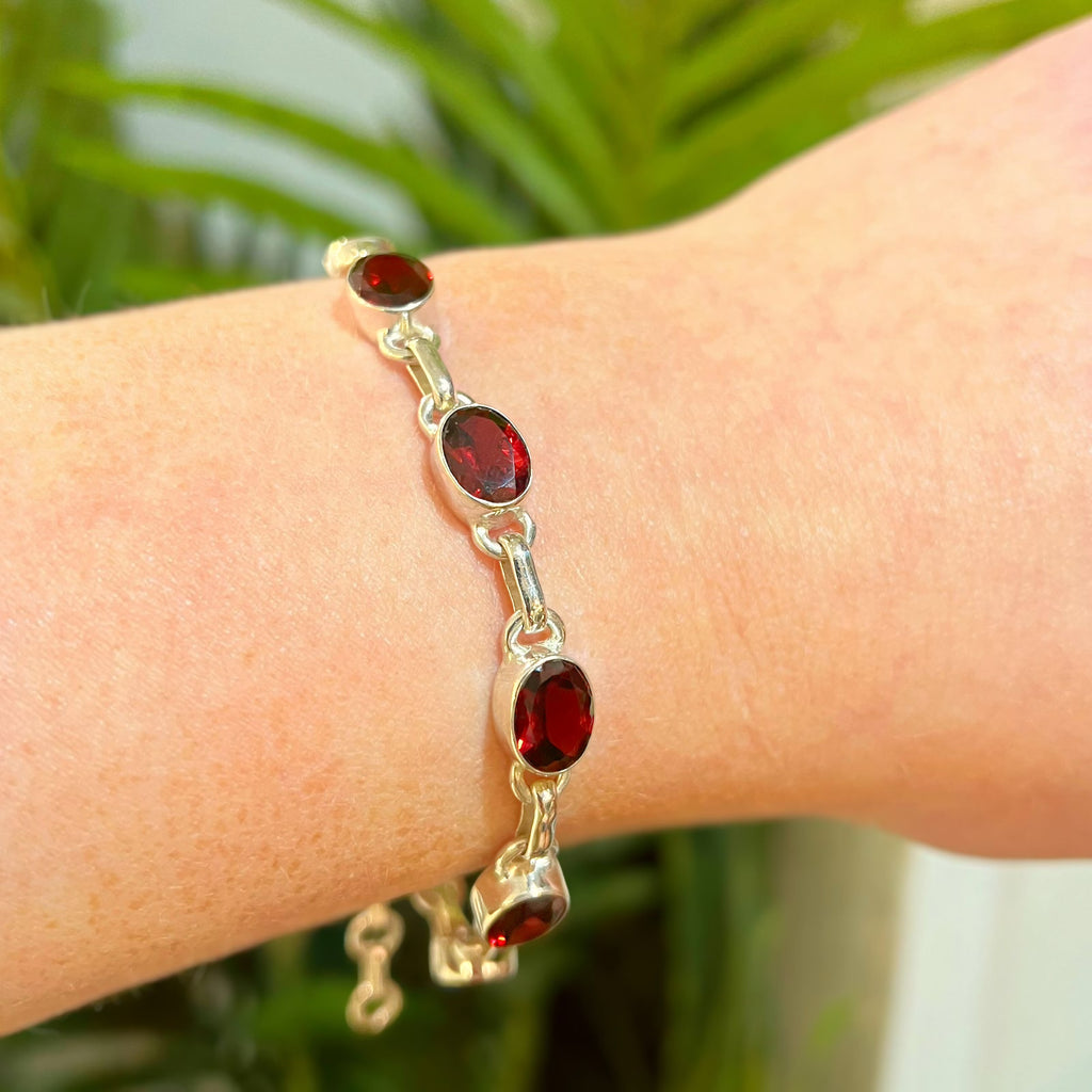 Oval Faceted Bezel Set Garnet Sterling Silver Bracelet