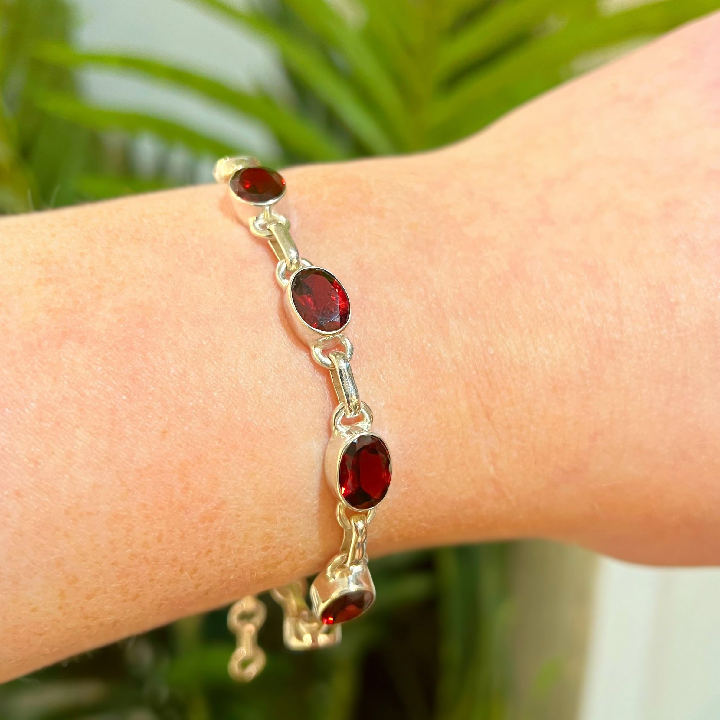 Oval Faceted Bezel Set Garnet Sterling Silver Bracelet