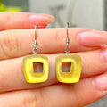 Yellow Hollow Squares Drop Earrings | Watch This Space