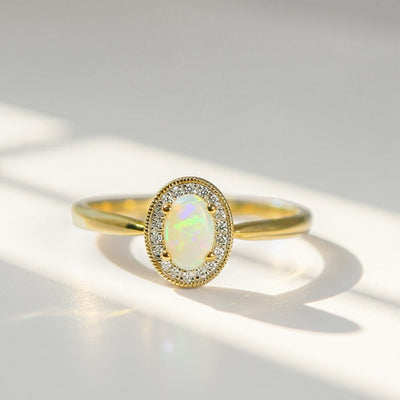 Oval Opal and Diamond 9ct Yellow Gold Halo Ring | Size O