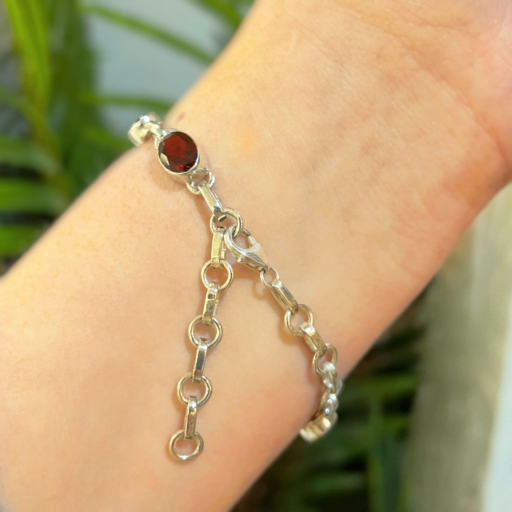 Oval Faceted Bezel Set Garnet Sterling Silver Bracelet