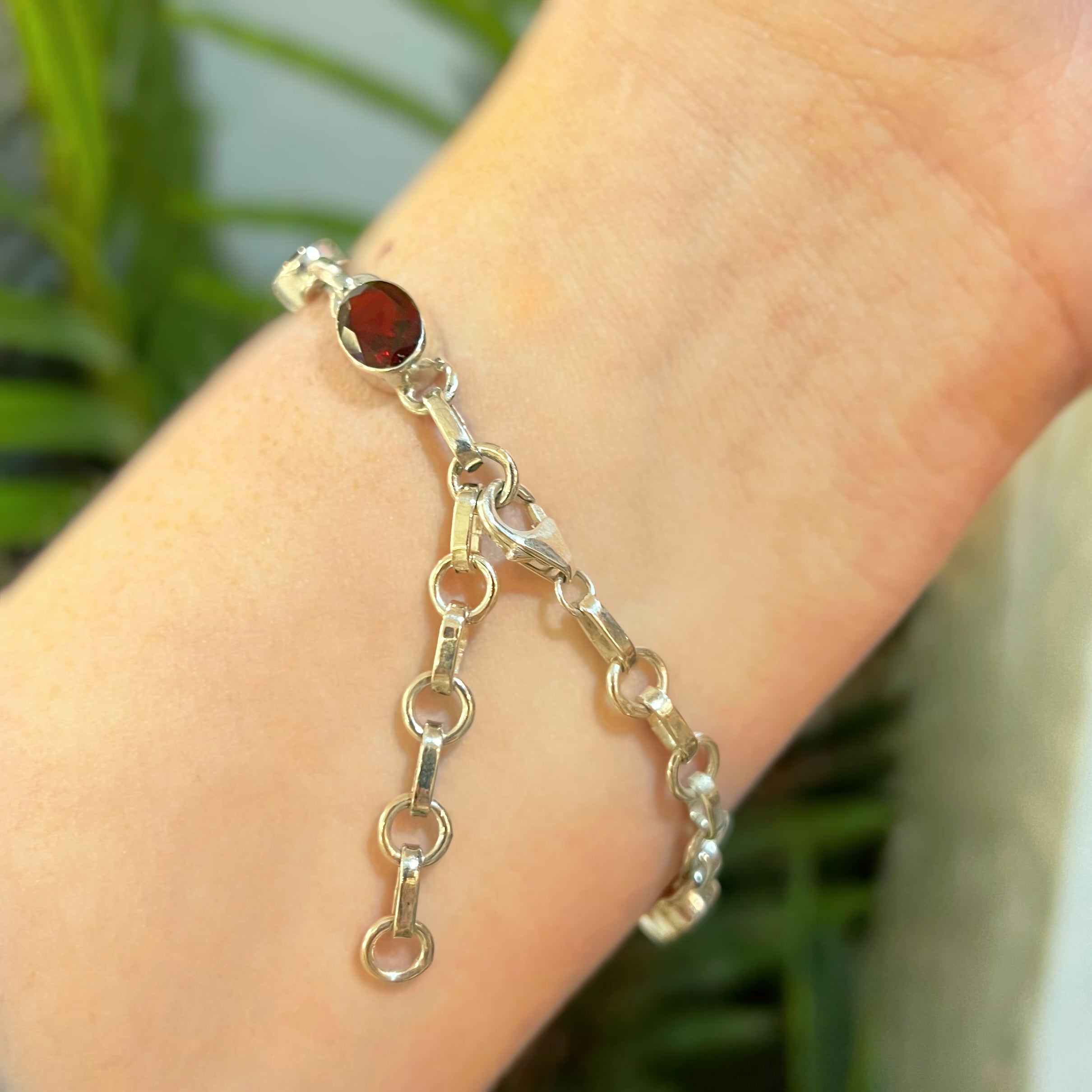Oval Faceted Bezel Set Garnet Sterling Silver Bracelet