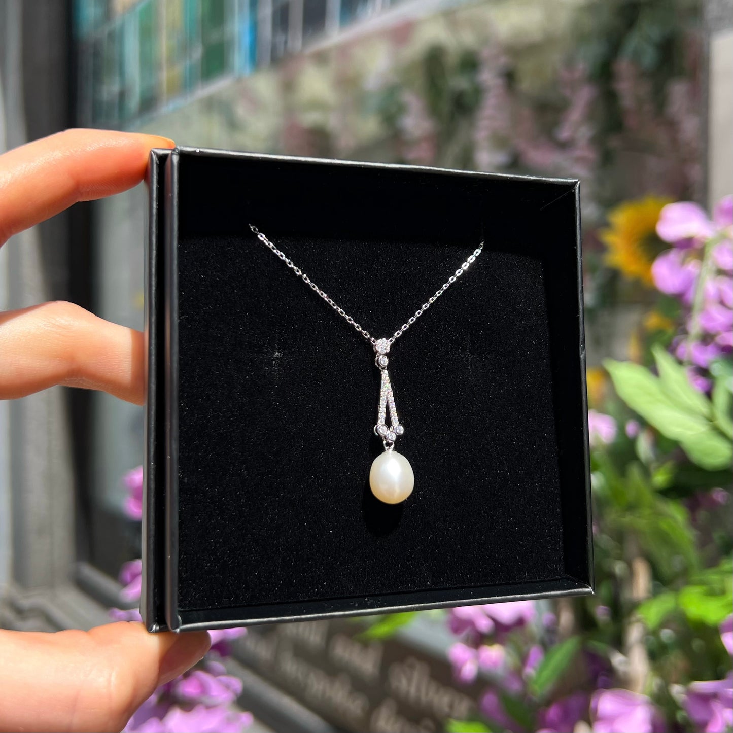 Sterling silver, cubic zirconia, and pearl pendant with chain