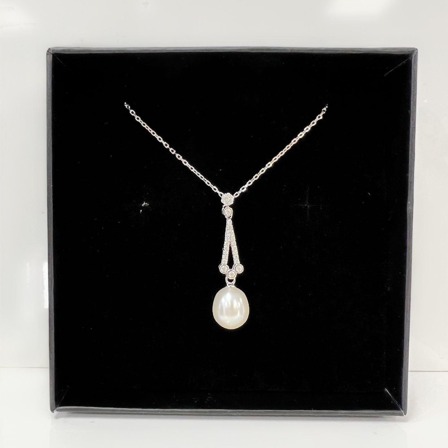 Sterling silver, cubic zirconia, and pearl pendant with chain